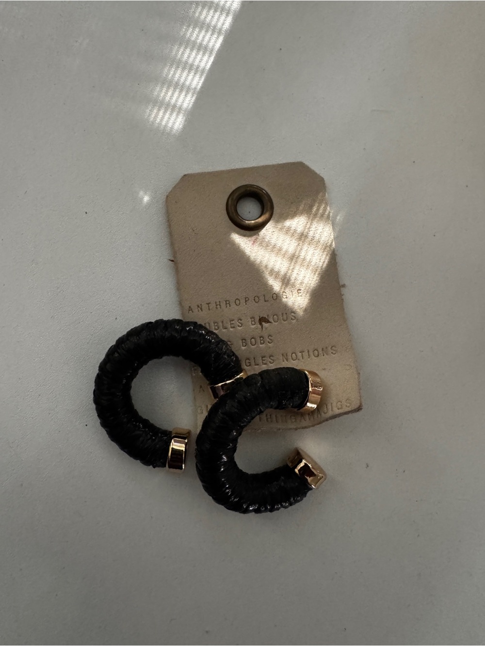 Anthropologie Black Wrapped Hoop Earrings with Gold Accents